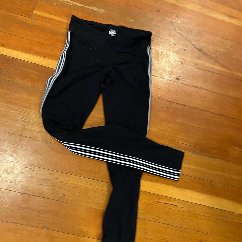 Black athletic leggings with stripped sides